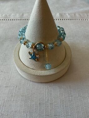 Light Blue Crackle Glass Gold Tone Stretch Bracelet